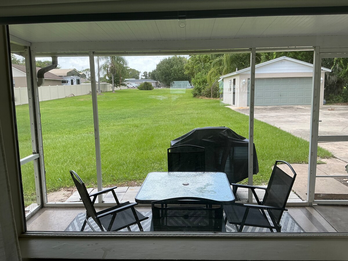 Screened patio and backyard